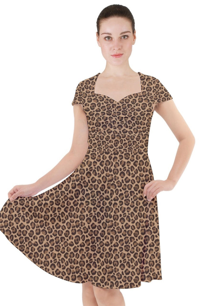 Leopard cap sleeve midi dress with pockets, showcasing elegant design and classic print, perfect for any occasion.