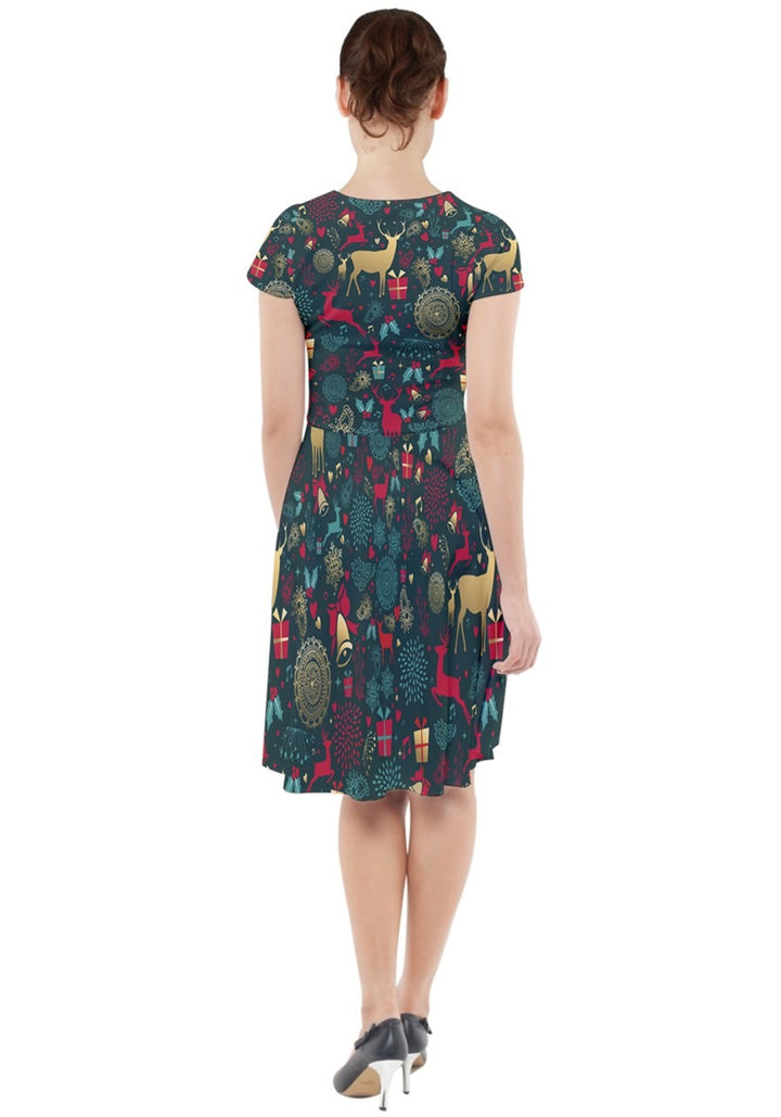 Woman wearing a Christmas Reindeer cap sleeve midi dress with pockets, featuring a festive pattern of reindeer and holiday decor.