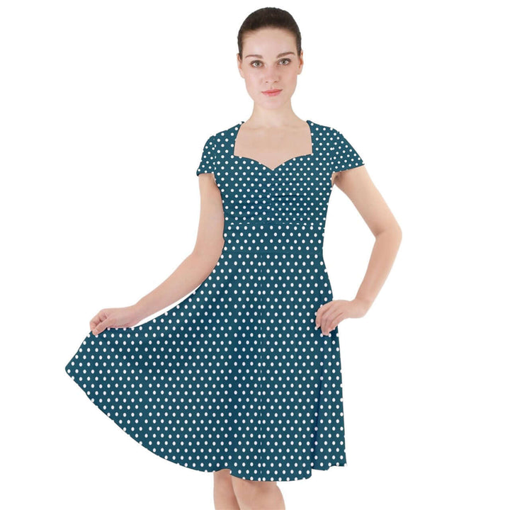 Teal polka dot cap sleeve midi dress with pockets, featuring a fitted bodice and flared skirt for a stylish look.