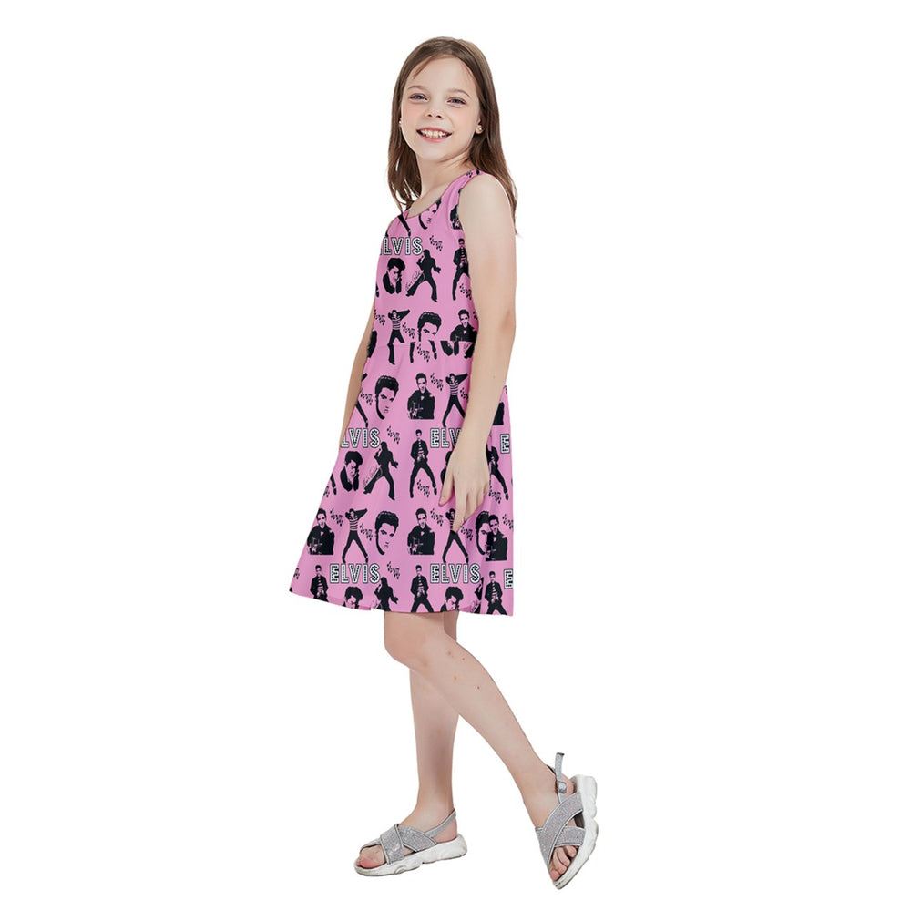 Girl wearing Elvis Jailhouse Rock kids skater dress with playful print on pink background, ideal for music-loving kids.