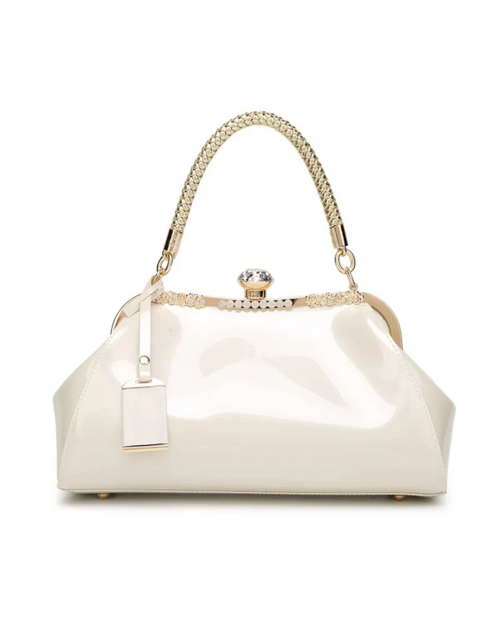 White patent women's handbag with a sleek design, braided handle, and rhinestone lock for a bold fashion statement.