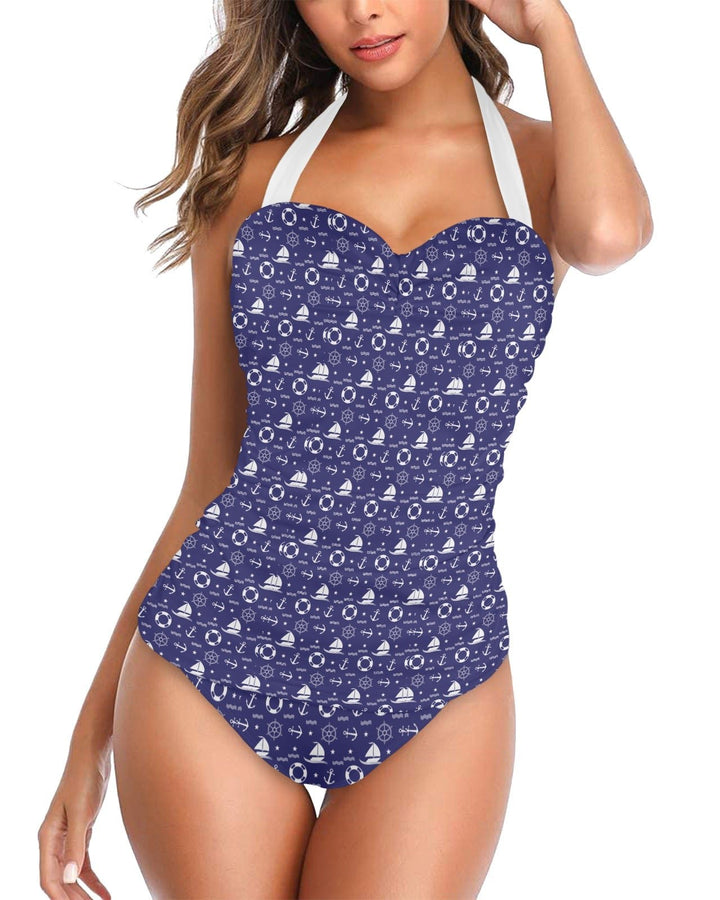 Nautical women's halter underwire swimsuit in navy blue with white patterns, ideal for beach or pool outings.