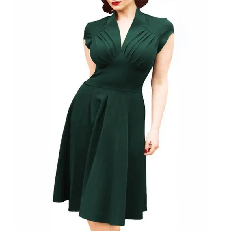 Timeless elegance vintage dress in dark green with chic cap sleeves and flattering silhouette, knee-length and stylish.