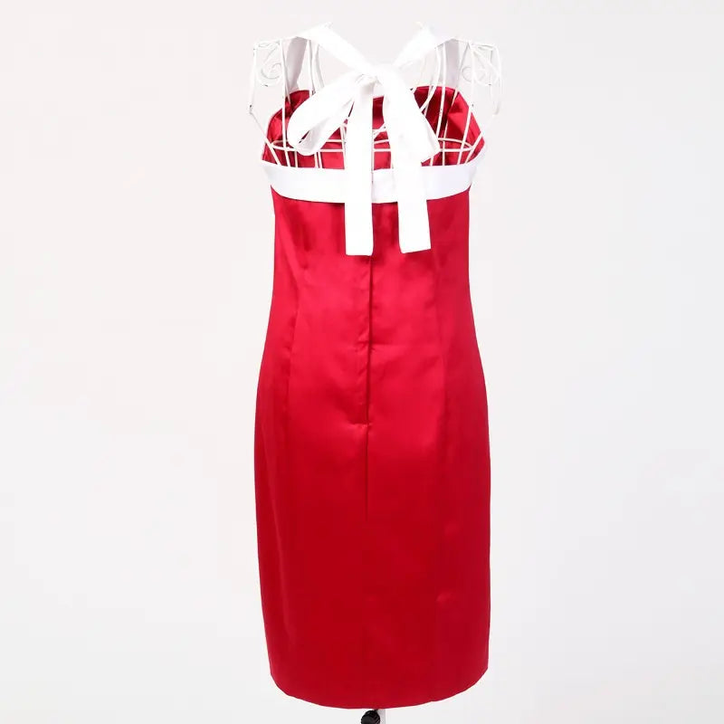 Bright red nautical pencil dress with a white bow, showcasing a flattering silhouette and vintage charm.