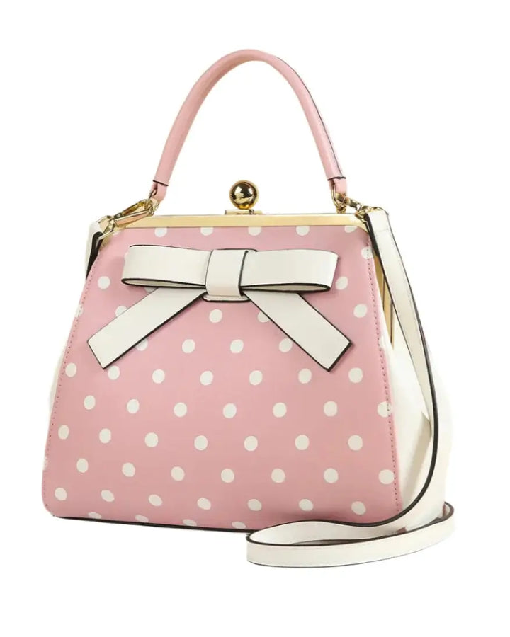 Pink polka dot rockabilly handbag with a bow, vintage style, perfect for retro outfits.