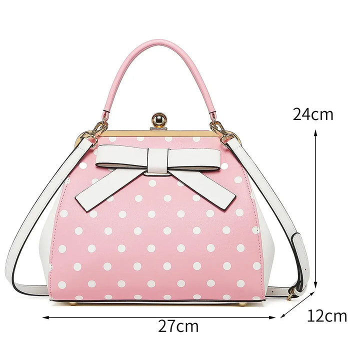 Pink polka dot handbag with bow, size 27x12x24 cm, vintage-inspired rockabilly accessory.