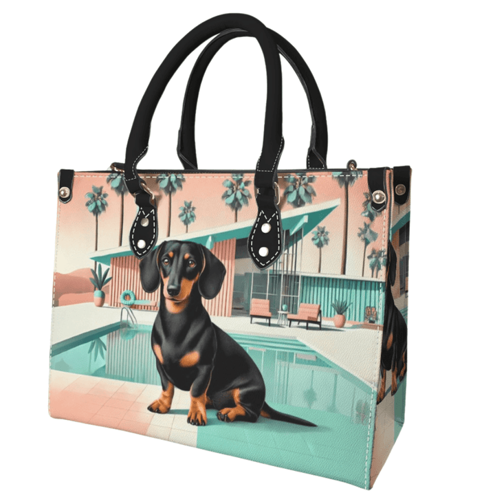 Palm Springs Dachshund handbag featuring a black and tan dachshund in a retro mid-century setting.