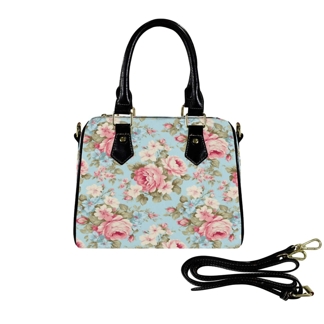 Vintage Roses Handbag in blue with floral pattern, featuring sturdy black handles and an adjustable strap.