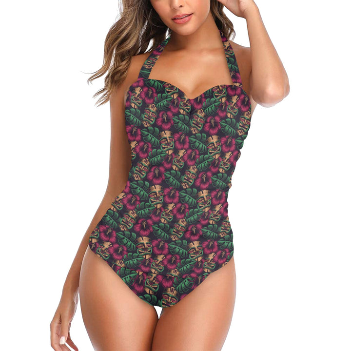 Leilani Tiki Halter Underwire Swimsuit featuring vibrant tiki print and supportive design for tropical beach vibes.