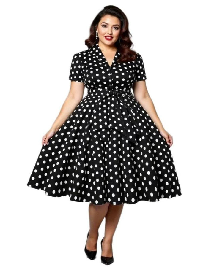 Black polka dot vintage swing dress featuring an A-line silhouette and playful big swing skirt, perfect for classic elegance.