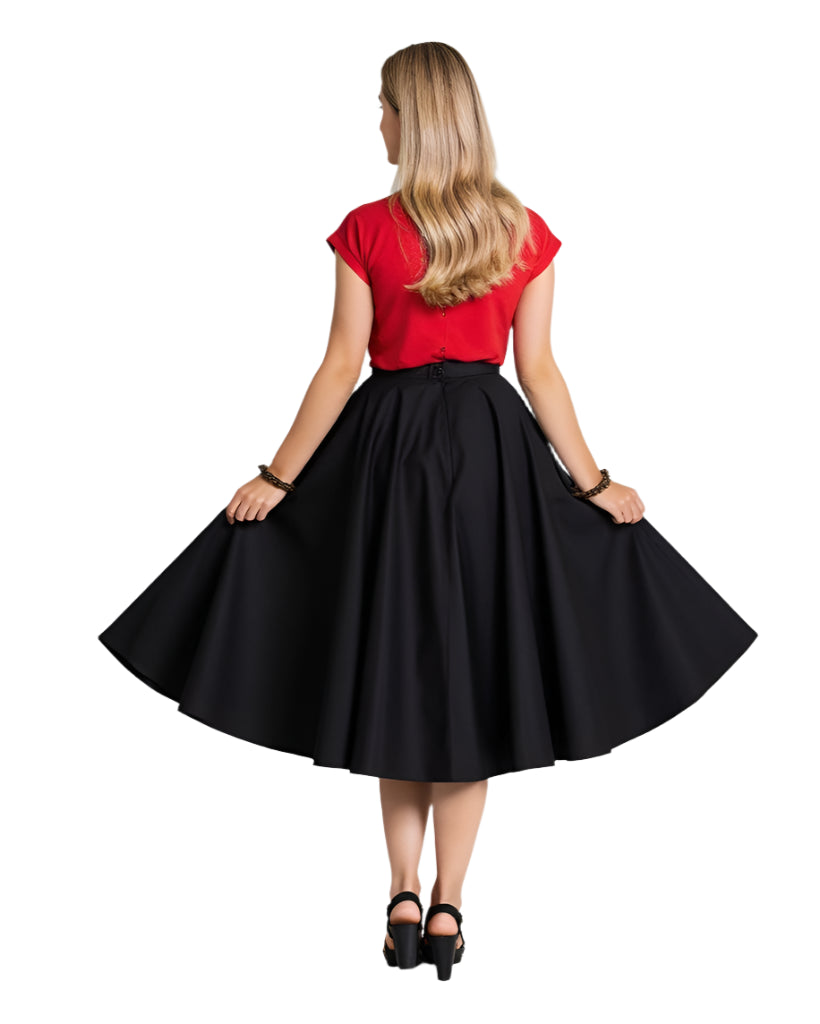 Woman wearing a classic black full circle skirt with a red top, showcasing the skirt's elegant silhouette and voluminous design.