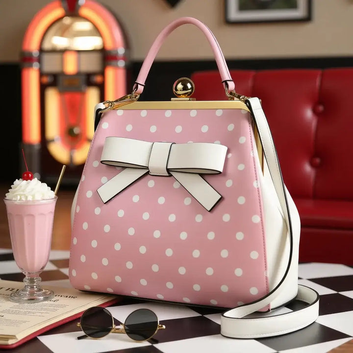 Vintage pink polka dot rockabilly handbag with a bow, perfect for retro fashion lovers.