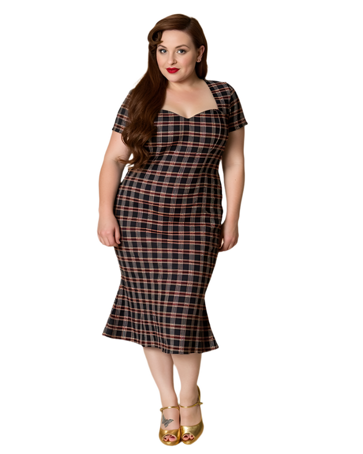 Model wearing the Elvis Ain't Dead swing dress, showcasing a plaid pattern and a flattering sweetheart neckline.