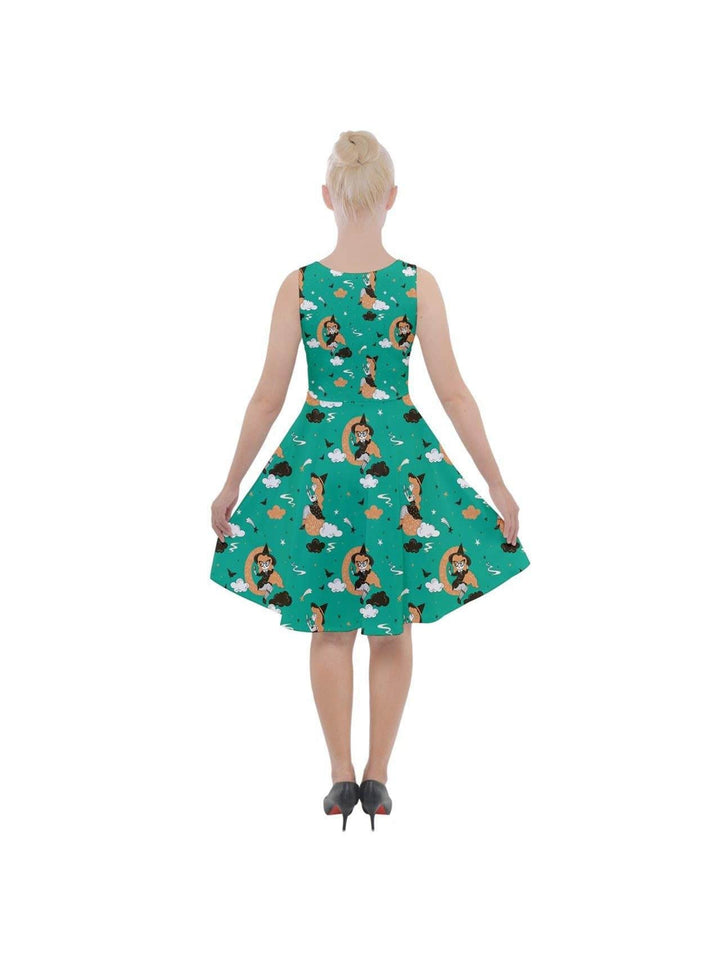 Back view of PIN UP WITCH GREEN knee-length skater dress featuring fun prints and pockets, styled for a flattering fit.