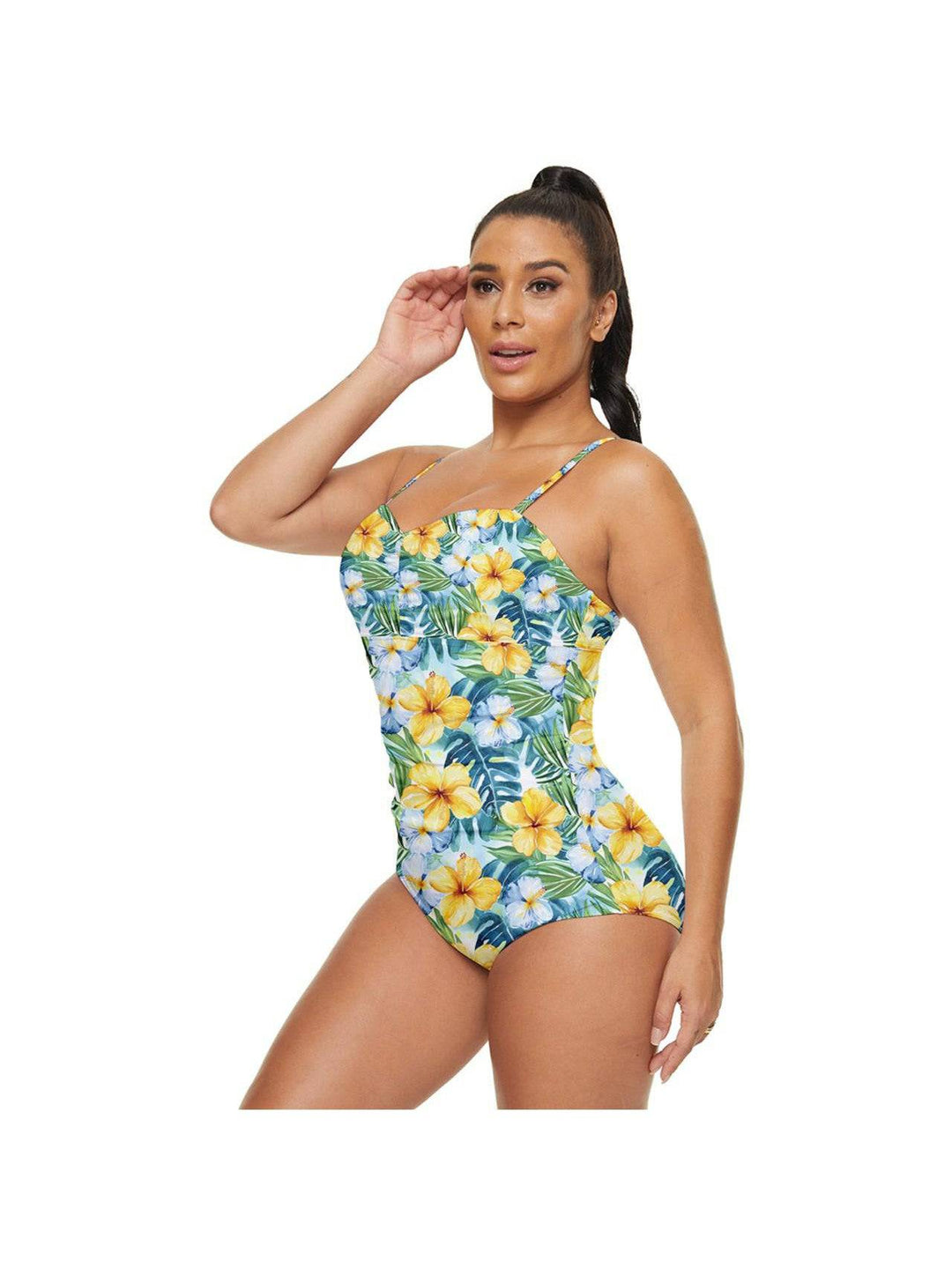 Woman modeling a Tropical Hibiscus full coverage swimsuit with vibrant floral print, perfect for beach days.