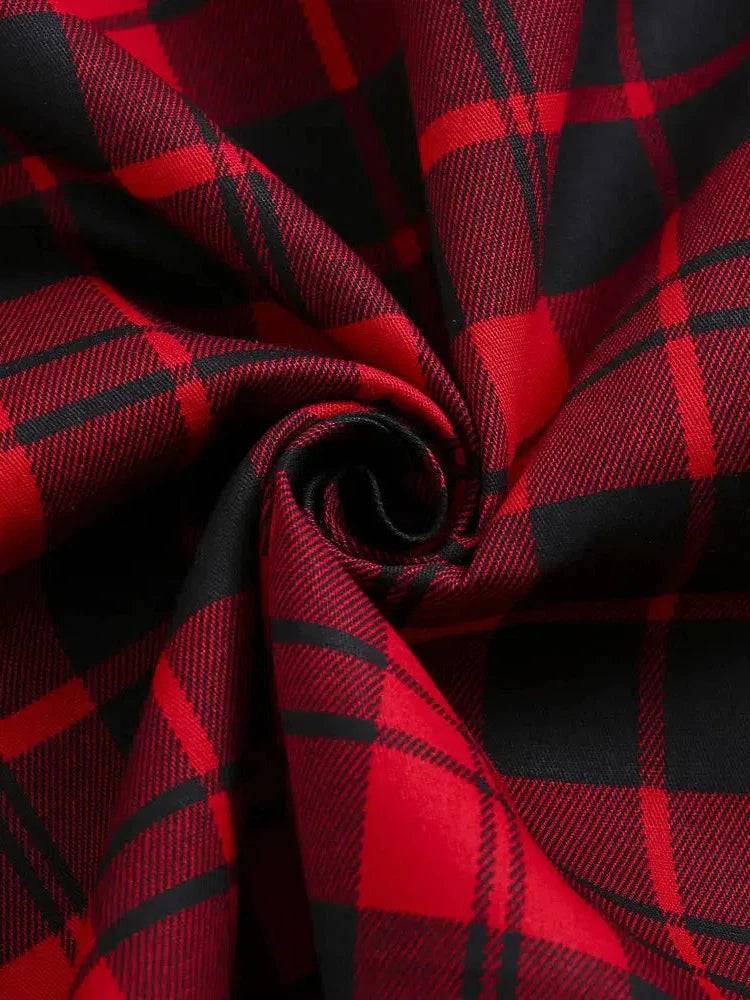 Close-up of red and black plaid fabric, showcasing a bold retro pattern perfect for stylish clothing designs.